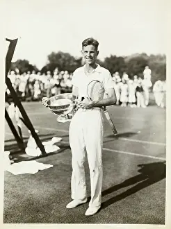 Ellsworth Vines Holding Tennis Cup