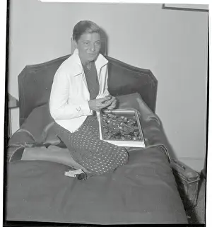 Elly Beinhorn Sitting on a Bed