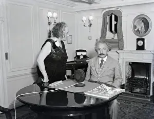 Prints of 1/28/1932-Prof. Albert Einstein is shown seated while his wife, Elsa Einstein is standing A Glimpse into Genius: Elsa and Albert Einstein