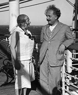 Prints of 1/28/1932-Prof. Albert and Mrs. (Elsa Einstein). Einstein arer shown on a ship looking at each other A Glimpse into Genius: Elsa and Albert Einstein on Ship Deck