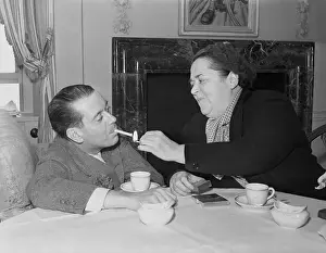 Elsa Maxell Lighting Cole Porter's Cigarette