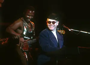 Prints of LOS ANGELES - CIRCA 1988: Pop singer Elton John performs onstage at the Hollywood Bowl in circa 1988 in Los Angeles, California. (Photo by Michael Ochs Archives/Getty Images) Rocket Man: From Stage to Spotlight: Elton At The Hollywood Bowl