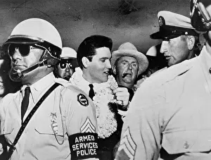 Elvis and the Colonel with a cadre