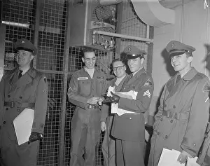 Autographing Prints: Elvis Presley with Army Buddies