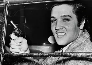 Handgun Prints: Elvis Presley Holds Toy Pistol