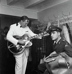 Private Prints: Elvis Presley Listens to Bill Haley Tune Guitar
