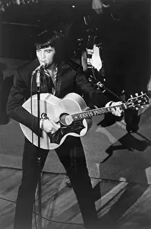 Elvis Presley Playing Guitar and Singing