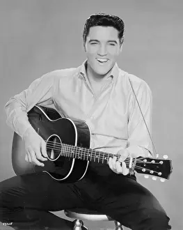 Elvis Presley portrait with acoustic guitar