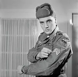 Elvis Presley Showing His Army Stripes