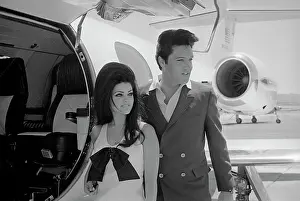 Tarmac Prints: Elvis and Priscilla Presley Posing near Airplane