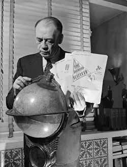 Formula One Prints: Ely Culbertson Studying Globe and Charts