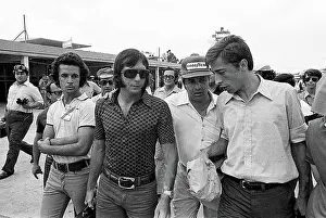 Prints of Brazilian Formula One driver Emerson Fittipaldi (center, in sunglasses) walks, with unidentified others, at the Argentine Grand Prix, Buenos Aires, Argentina, January 29, 1973 Legends of the Track: Emerson Fittipaldi With Others At The Argentine Grand Prix