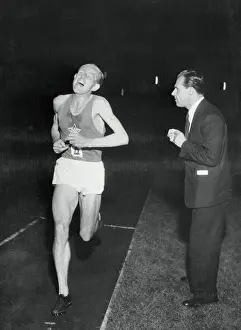 Track Official Prints: Emil Zatopek Running to Break Record