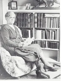 Emile Loring Reading Book in Chair