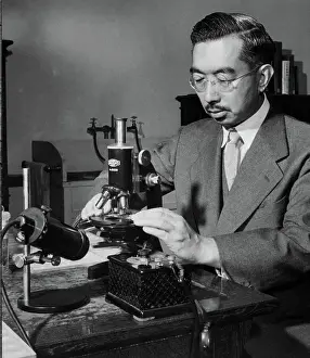 Emperor Hirohito Putting Slide Under Microscope
