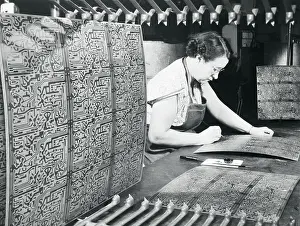 Employee Inspecting Printed Circuits
