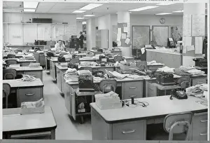 Two Employees in Large Office