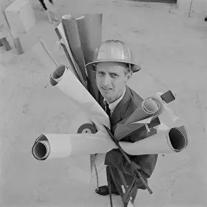 Blueprint Prints: Engineer holding blueprints, portrait
