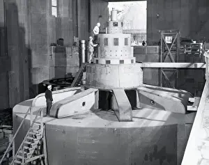 Prints of (Original Caption). Westinghouse engineers check the performance of R-1, the tenth 108, 000 kilowatt generator installed at Grand Coulee Dam, as it picks up a load for a preliminary test A Timeless Collection of Hoover Dam Photography: Engineers Check Generator At Dam