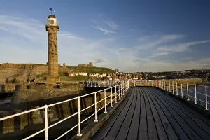 England, North Yorkshire, Whitby, pier and lighthouse