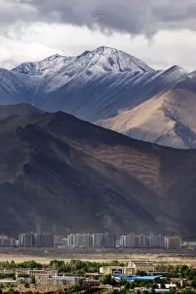 Images Dated 29th May 2016: The enormous mountain range and the new city of Lhasa