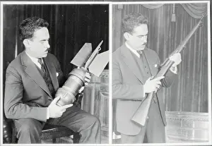 Enrique Estrada Examining Bomb and Rifle