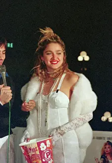 Entertainer Madonna at Movie Premier with Bucket of Popcorn