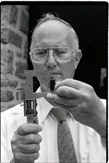 Entomologist Measuring Cockroach Size