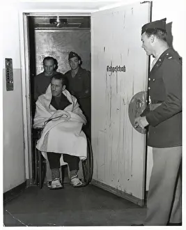Erast Kaltenbrunner in wheelchair