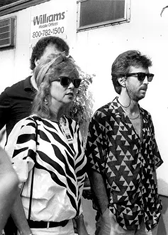 Iconic Concert Prints: Celebrate the Unforgettable Music Event That United the World: Eric CLapton and wife Patti backstage at Live Aid, Philadelphia