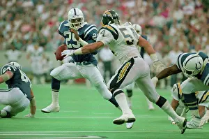 Eric Dickerson and Billy Ray Smith During Football Game