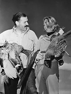 Ernest Hemingway and Martha Gellhorn Holding Birds Art