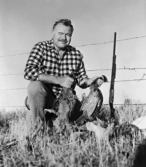 Ernest Hemingway Showing his Pheasants