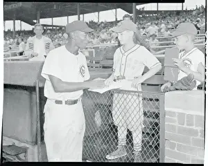 Ernie Banks Signing an Autograph