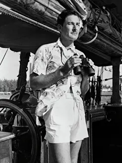 Errol Flynn with Binoculars Aboard His Yacht