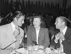 Rivalry Prints: Errol Flynn and Bruce Cabot Adjust Ties