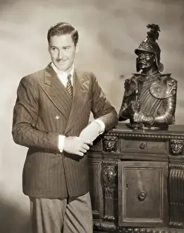 Errol Flynn Leaning on Cabinet