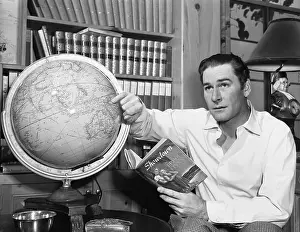 Errol Flynn Observing Globe