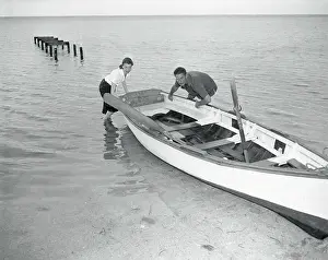 Princess Of Romania Prints: Errol Flynn and Princess Irene Guiding Canoe