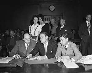 Errol Flynn Speaking to His Attorneys in Courtroom