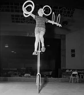Unicycle Prints: Ervine Hall Riding Unicycle While Juggling Hoops