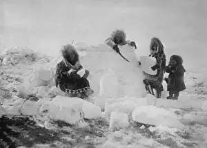Eskimo Women Building A Snow Igloo