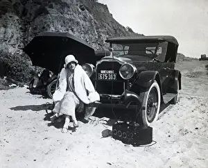 Estelle Taylor Sitting on Car at Beach