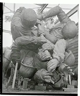 Eugene Bedi Working on a Sculpture