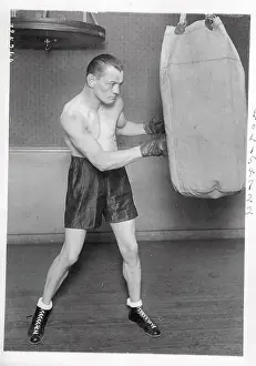 Eugene Criqui Hitting Punching Bag