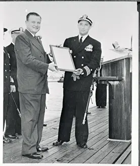 Eugene Wilkinson and John Hopkins Holding a Plaque