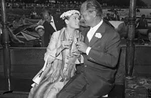 Eva Bartok and Curd Juergens Toasting to Each Other