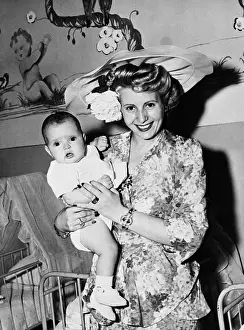 Eva Peron Posing with Baby