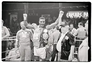 Evander Holyfield Raises Arms Wears Belt