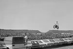 Automobile Prints: Evel Knievel Jumping Motorcycle over Cars